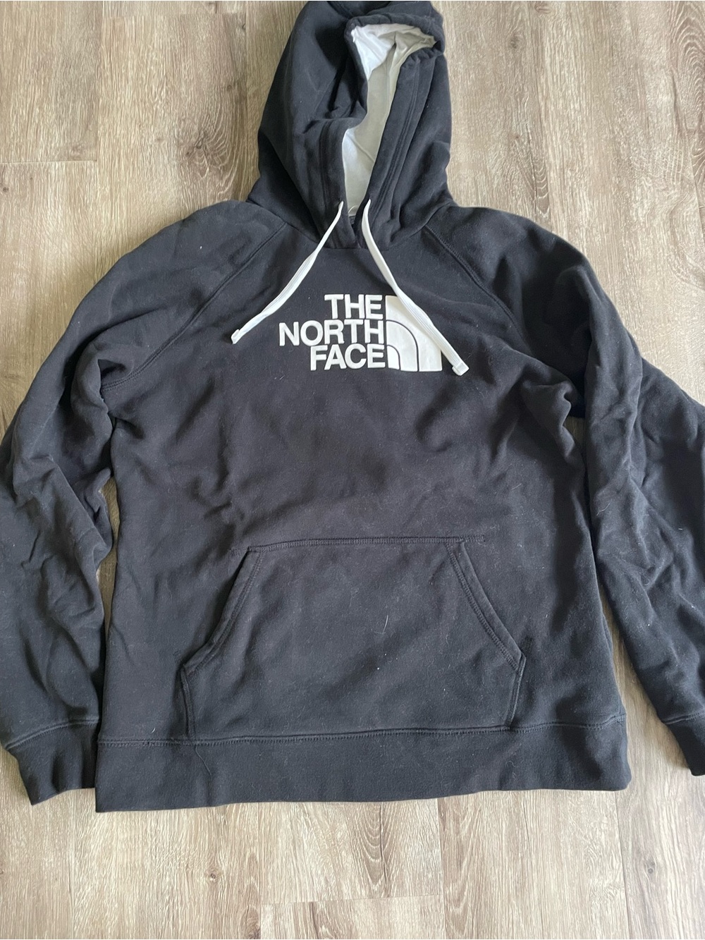 The North Face Black Hoodie with White Logo and Drawstrings